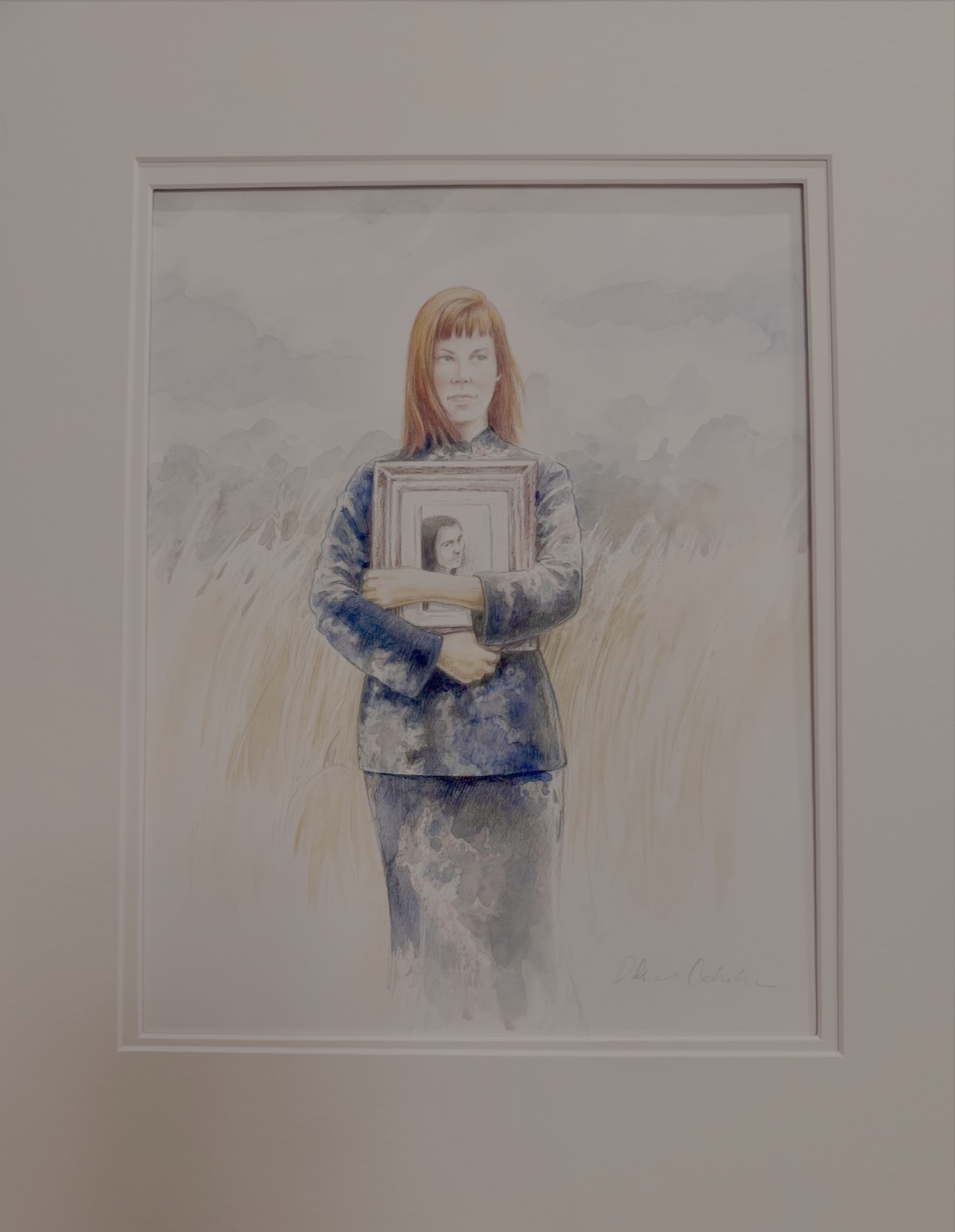 Portrait of Lorri Davis holding a framed photograph in a field — original artwork by Arcane Visions
