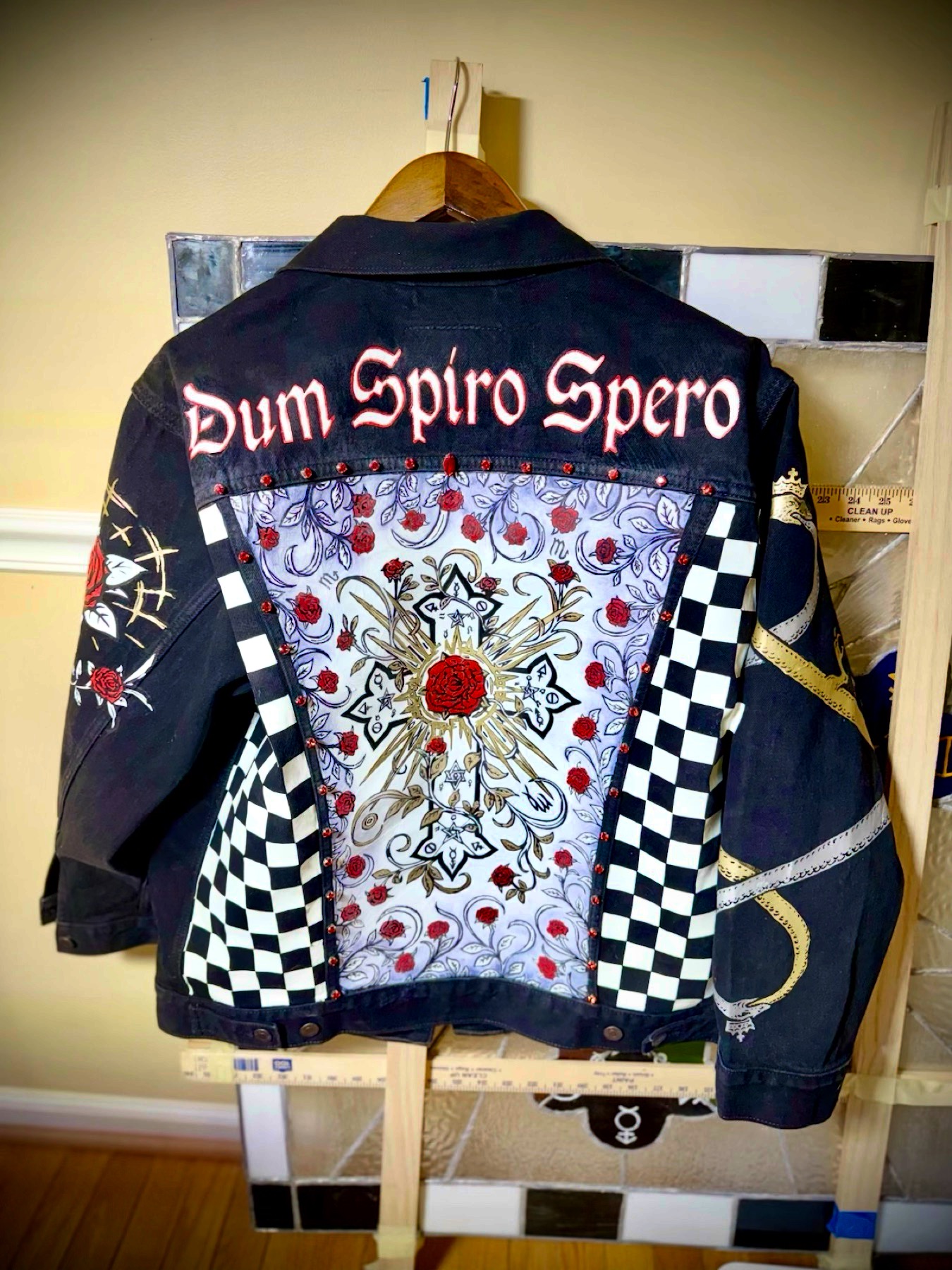 The jacket on display — full back composition, the Rosy Cross beneath Dum Spiro Spero