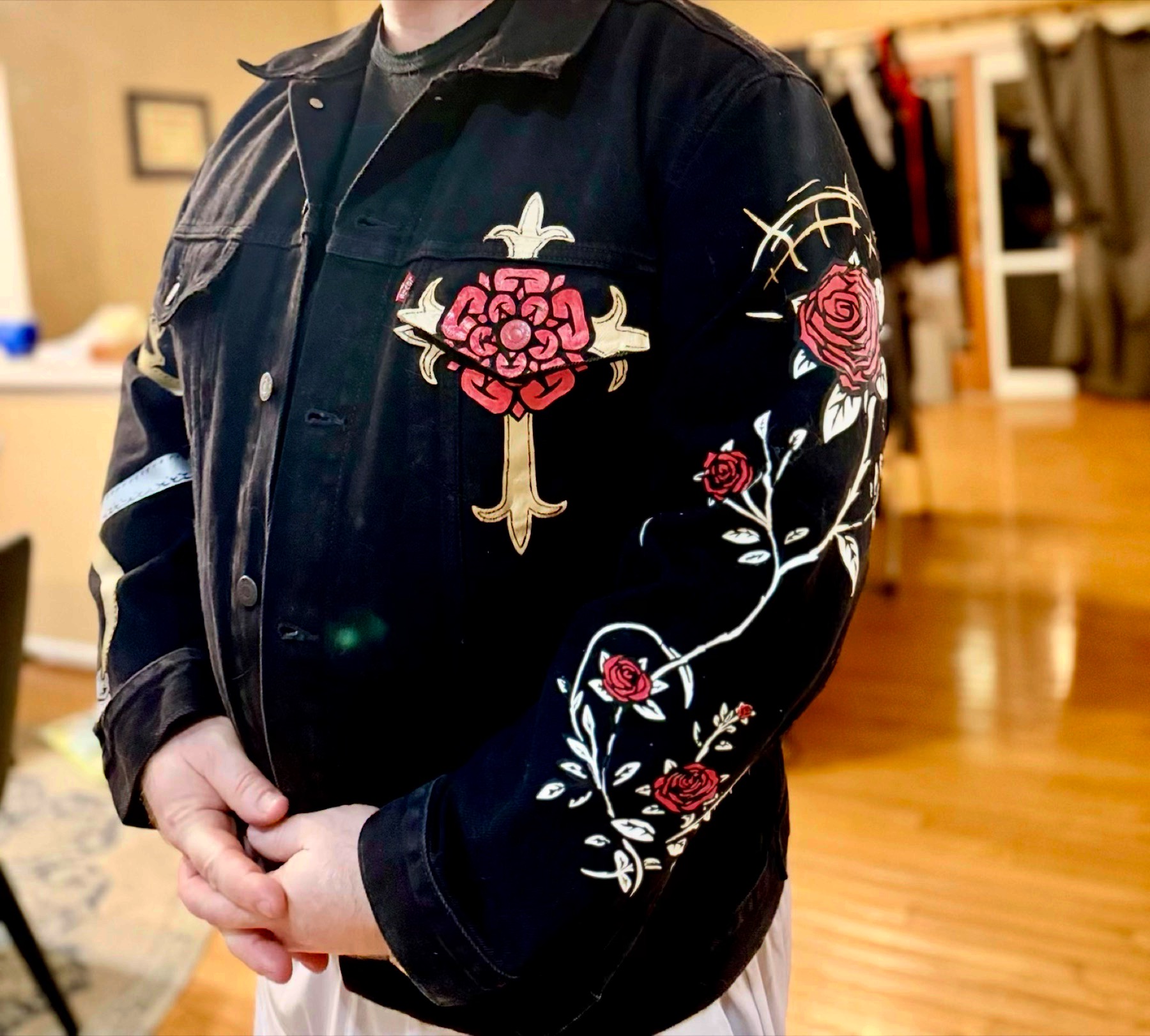 Front view worn — the chest Rosy Cross and a painted rose sleeve