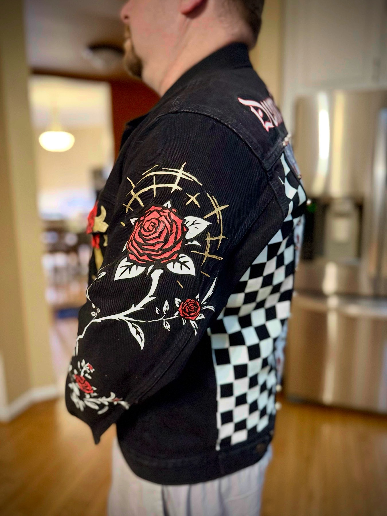 Rose sleeve detail — hand-painted roses and thorned vines