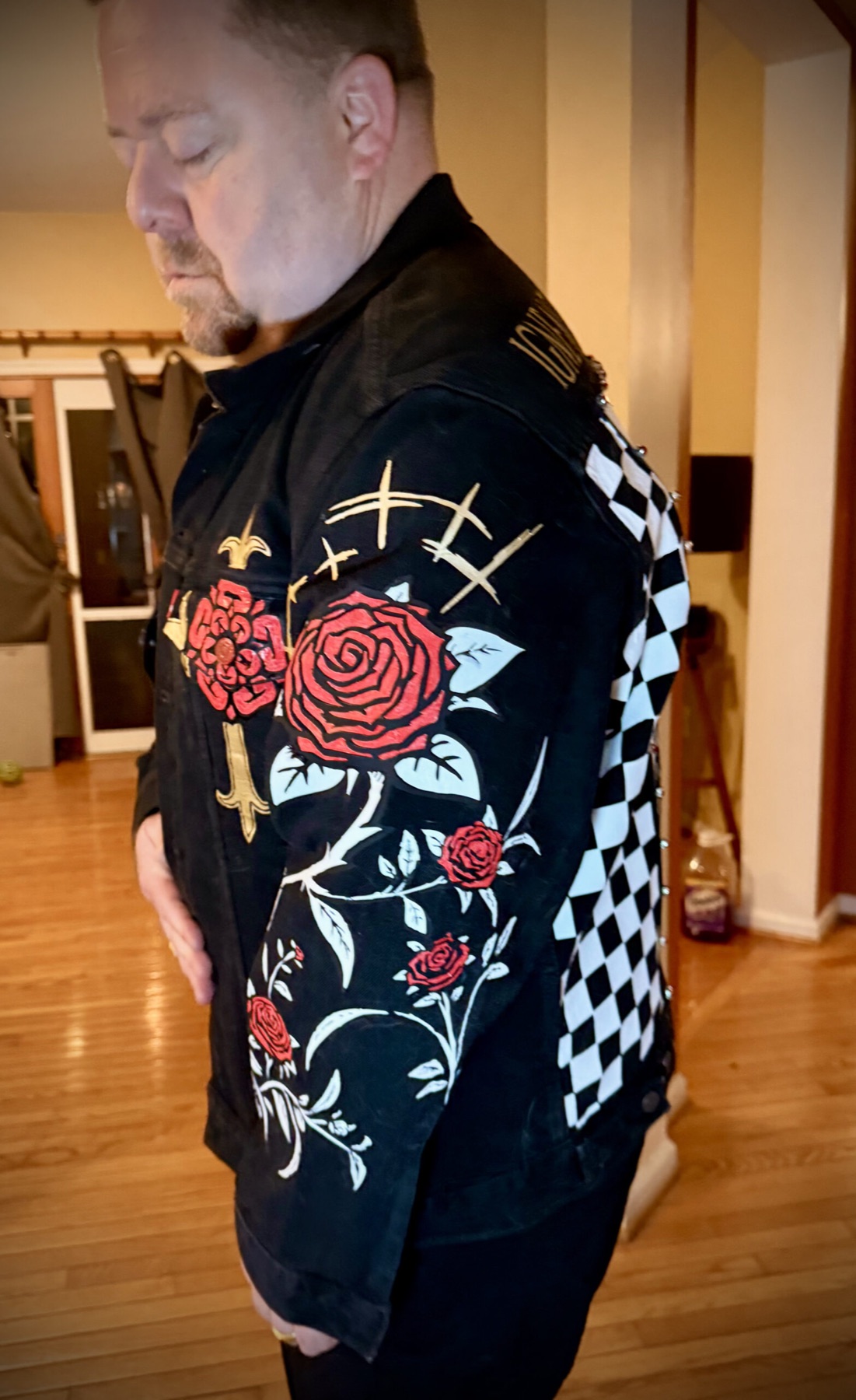 Pelican Battle Jacket — rose sleeve detail, hand-painted roses and thorned vines